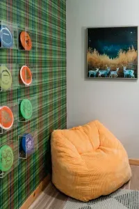 Every camper needs a cozy corner. This one’s made for curling up after a round of bumper pool 