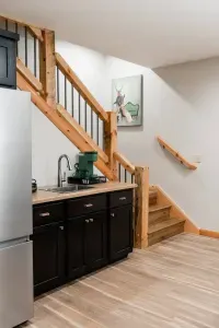 Tucked at the foot of the stairs and right at the entrance to the Deer Den, this basement kitchenette keeps snacks, coffee, and cocktails close at hand—so the fun never has to pause