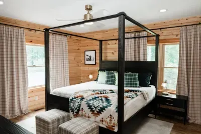 The main floor primary suite is a retreat within a retreat. Perfect for grandparents, early risers, or anyone who loves convenience. With a king canopy bed and medium-firm Zinus mattress, it’s a cozy landing spot after a day of mountain adventures