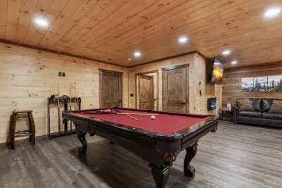 Pool table in game room. 