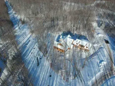 Alpine lift on the left,  ski trail in background,   Private setting