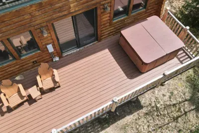 Rear deck with hot tub and relaxing chairs 