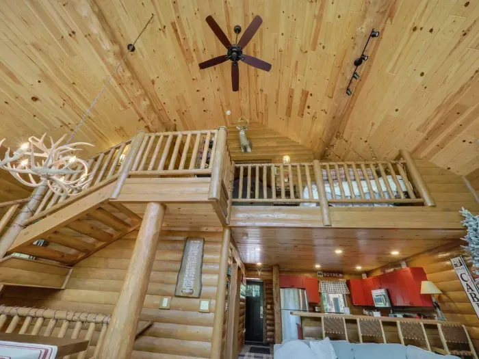 Tall ceilings, view from living room up to balcony and master suite.