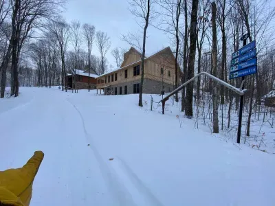 I am pointing to Hildas trail, note the snow making equipment, and sign to the lifts, literally steps from the back door,   location, location, location!!