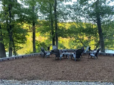 Spacious fire pit area overlooking the lake