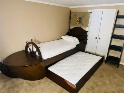 Twin boat bed with twin pull out trundle bed