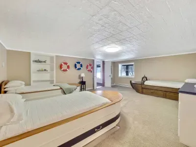 Boat bedroom with three twin beds and three trundle beds - sleeps six.  Extra linens are located in the boat bow cabinets. 