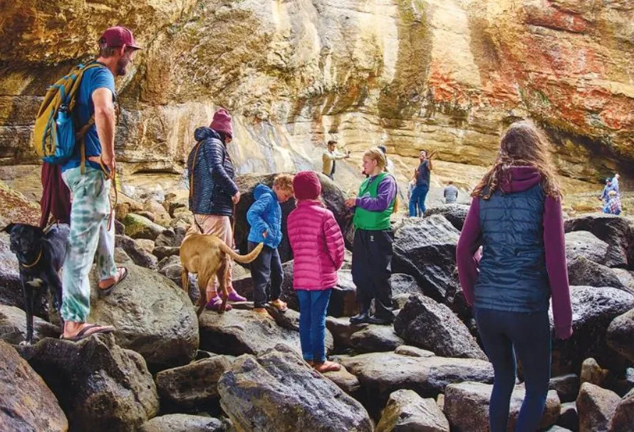 Friends of Otter Rock Marine Reserve volunteer teaching visitors about marine life and coastal conservation on the Oregon Coast