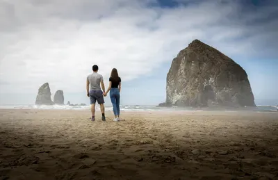 Romantic anniversary proposal trip on the Oregon Coast at sunset