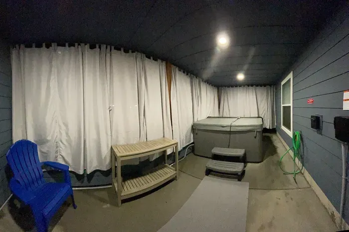 Hot Tub on Lower Level Patio - with Privacy Curtains Closed.