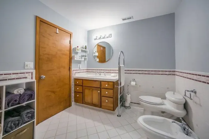 Downstairs master bath with a bidet and...