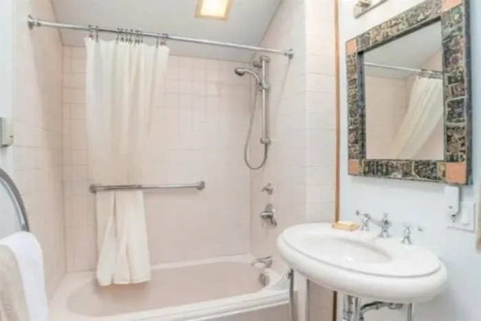Upstairs master bath has a shower tub combo and another skylight!