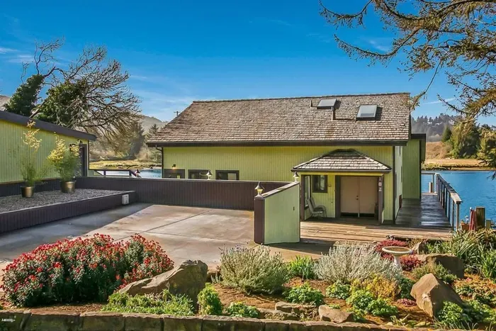 Parking area and front entrance to the house.