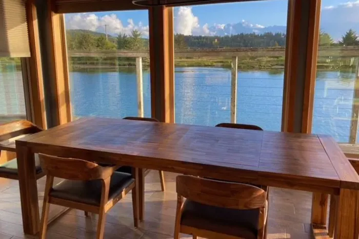 Large dining table for all of your guests surrounded by more windows and views of the river. Comes fully equipped with a coffee and espresso bar to make the most of your mornings.