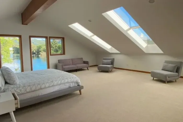 Upstairs master with river and mountain (hills, really) views - skylights fill the room with natural light and let you fall asleep under the stars.