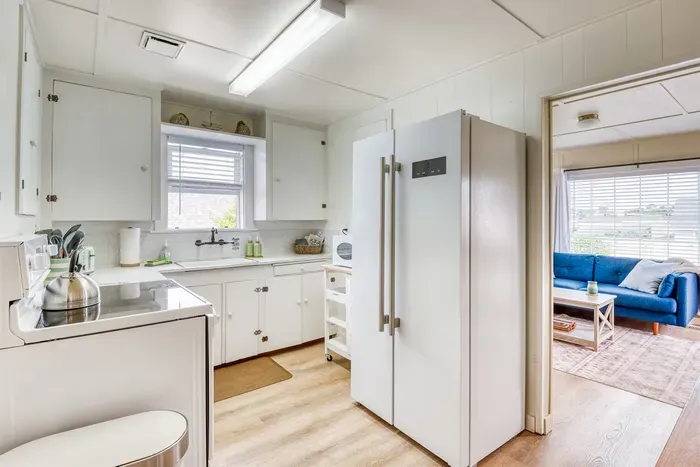 Kitchen with Side By Side Refrigerator Freezer