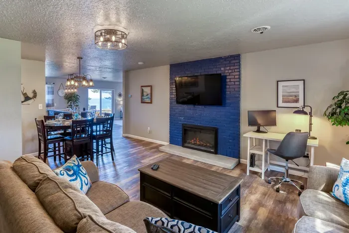 Cozy Family Room area with Fireplace and Large TV