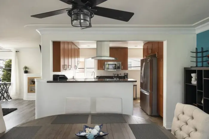 The dining area opens up to the full kitchen and living area