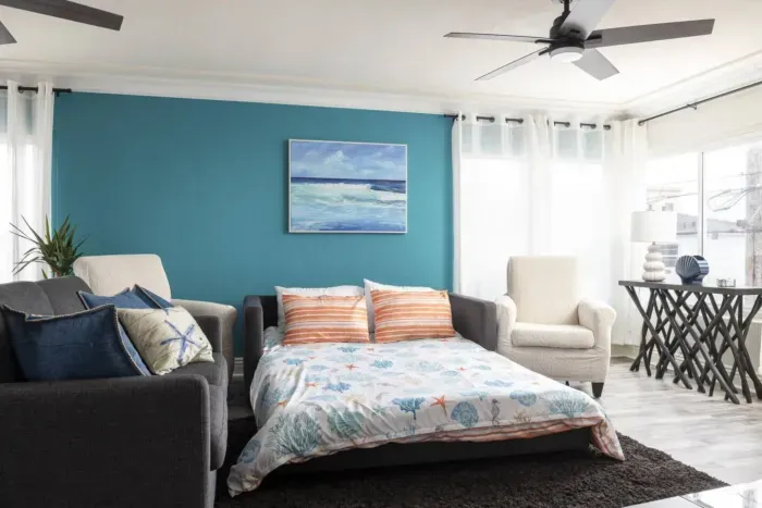 The living room has a fold out sofa bed, size queen