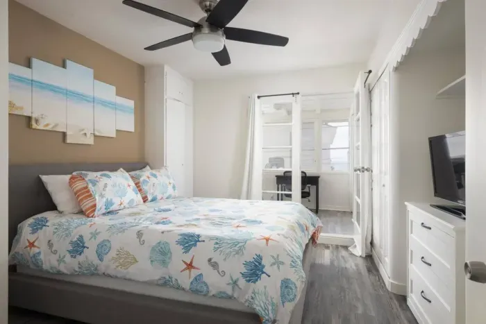 Bedroom 2 is attached to the office and has peek-a-boo ocean views. The doors can be closed with curtains to block out light and for privacy