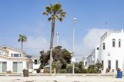 Just steps from the beach! We are the unit on the left one house back from the sand)