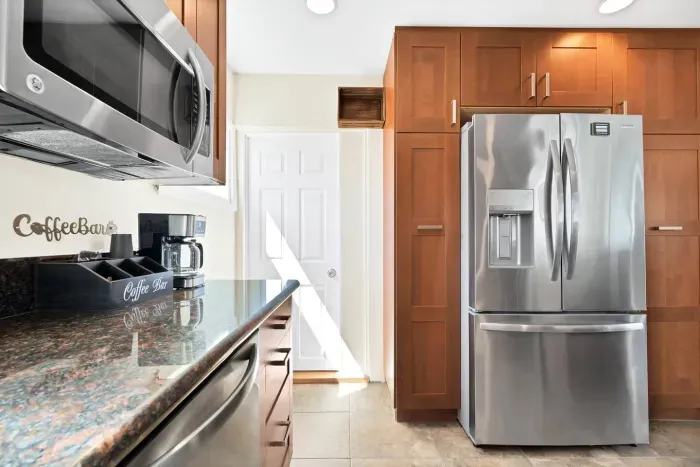 Enjoy your full kitchen, stocked with everything you need to cook meals for your group. The door in the photo leads into the office area