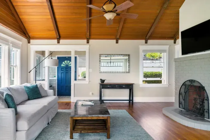 Cozy living room with a fireplace and entertainment-ready TV.