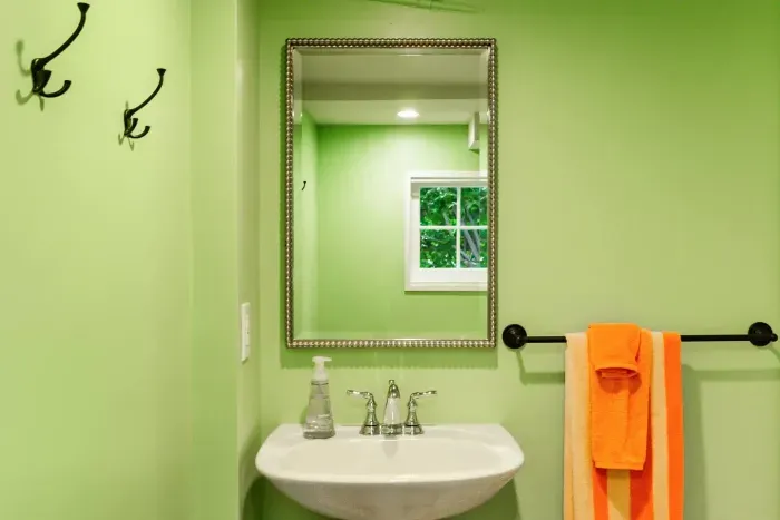 Bathroom sink with an elegant mirror for convenience and style.