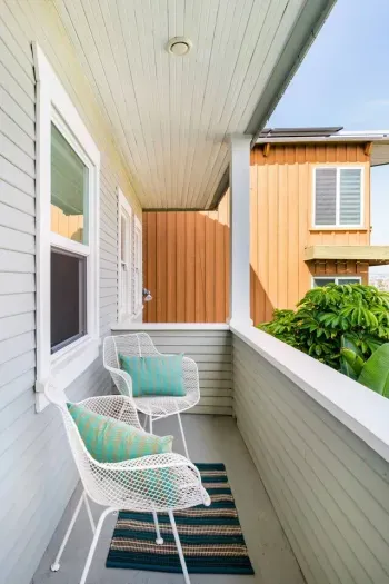 The primary bedroom has a private balcony with sit-down views of the Bay and downtown skyline.