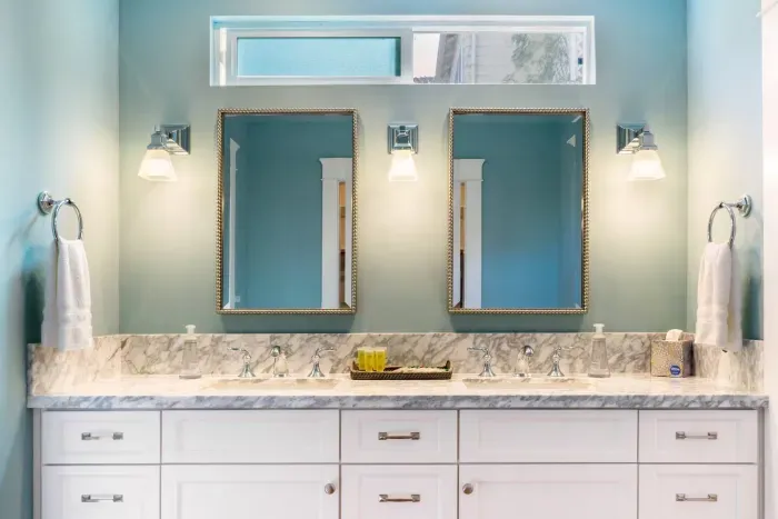 Dual sinks with matching mirrors for convenience and style in the bathroom.