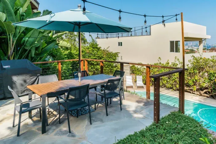 Poolside alfresco dining experience with scenic views.