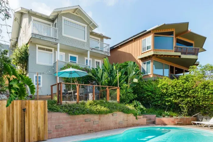 The view of our home from the pool area. The home cascades down the hill, providing incredible views!