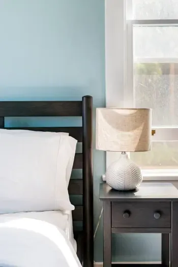 Convenient bedside lamp for cozy evenings.