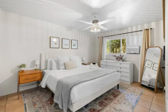 Inviting and cozy bedroom with comfortable bedding for a restful night's sleep.