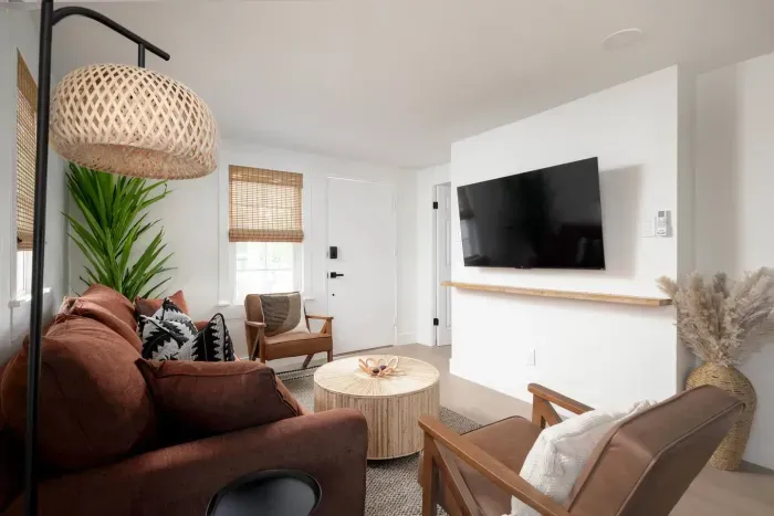 Bright kitchen with modern finishes, stainless steel appliances, and coffee maker for your morning brew.