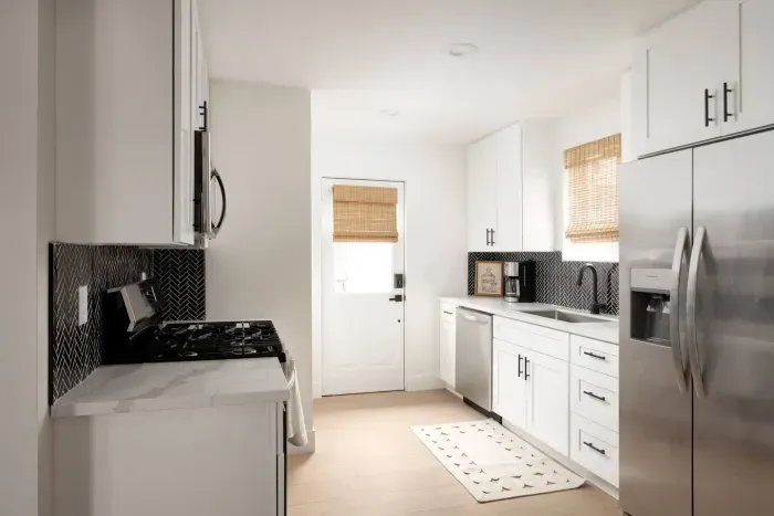 Fully equipped modern kitchen with stainless steel appliances, sleek finishes, and everything you need to cook at home.