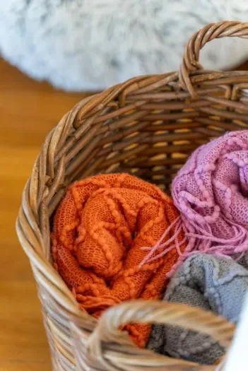 Cozy blankets in basket