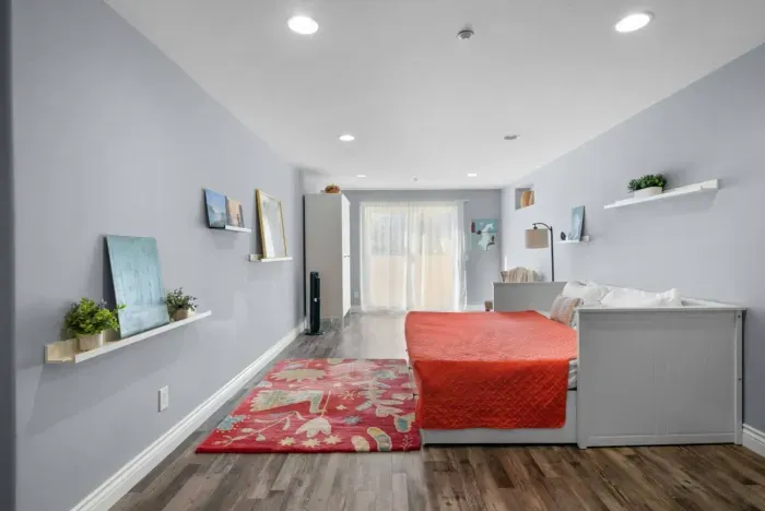 Bedroom 4 is a spacious bedroom with backyard access