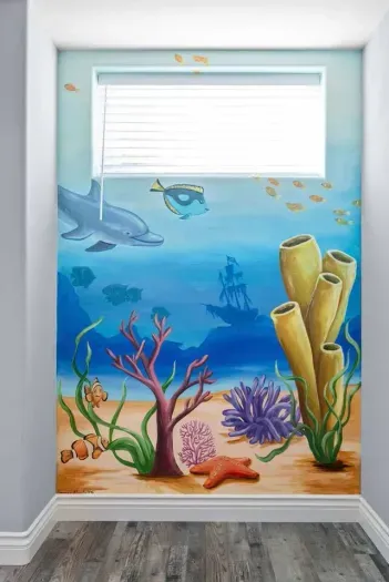 Bedroom 3 has coastal-inspired wall art