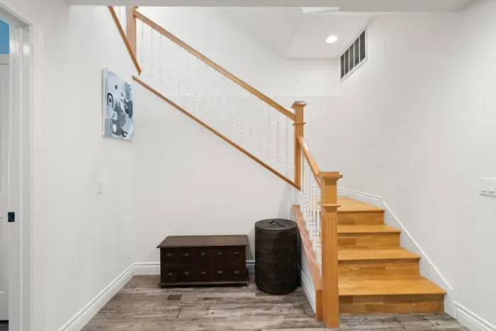 Stairs to the lower level and Bedrooms 3 & 4