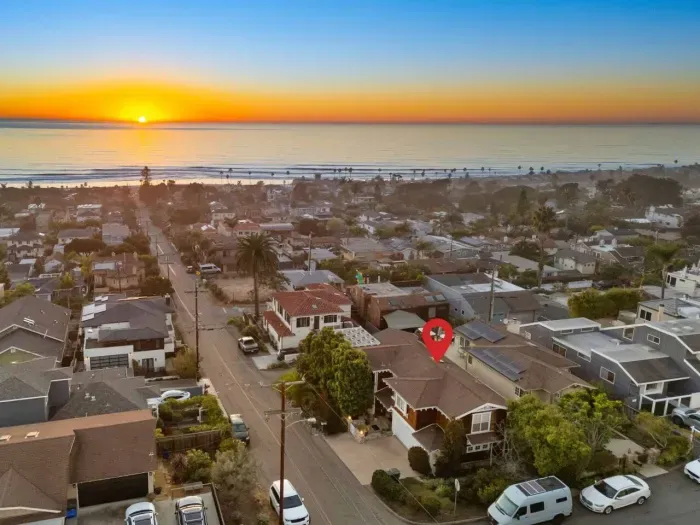 Stunning aerial view of sunset overlooking the charming neighborhood!