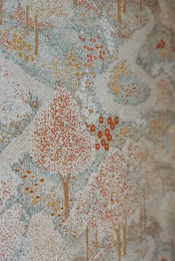 Charming vintage wallpaper adds character and personality throughout.