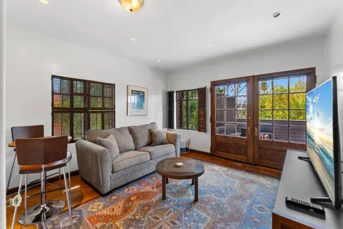 Sunlit upstairs suite with classic details and a private patio escape.