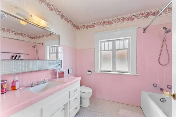 Retro pink tile, original wallpaper, and a story worth staying in.
