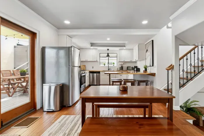 Modern kitchen with stainless steel appliances.