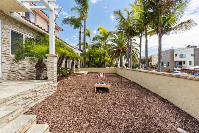 Side yard play area with family-friendly setup.