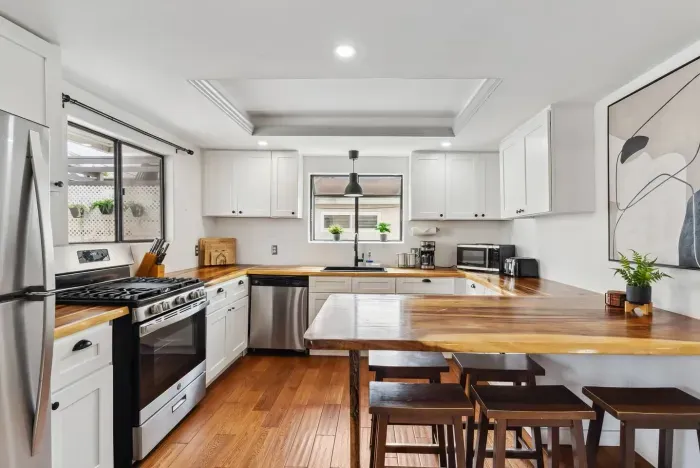 Bright kitchen with center island and seating.