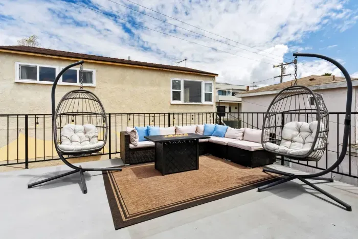 Rooftop patio with lounge seating and city views.