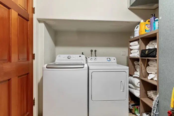 Convenient laundry nook with washer and dryer.