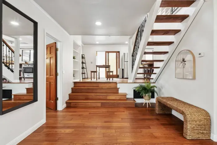 Elegant staircase leading to the upper level.